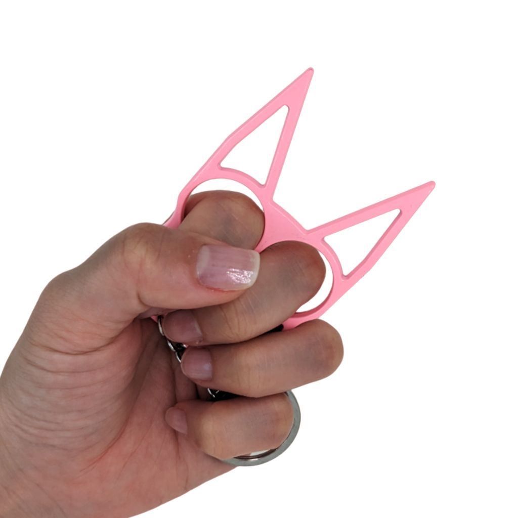 Pink Cat Ears Self Defense Knuckles Keychain Held by Model