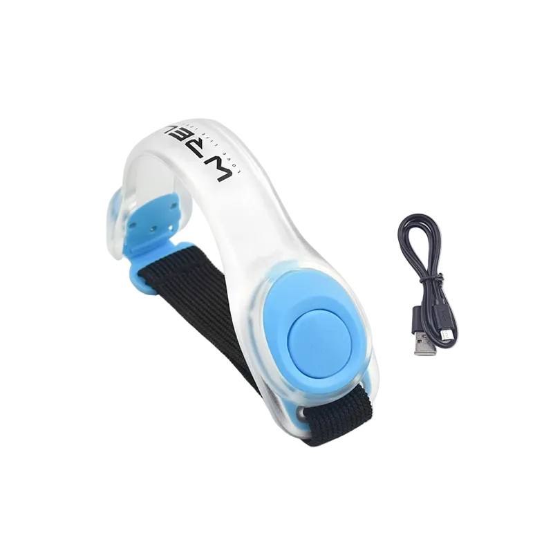 White and blue electronic LED light runner's safety device with a USB cable for recharging on a white background
