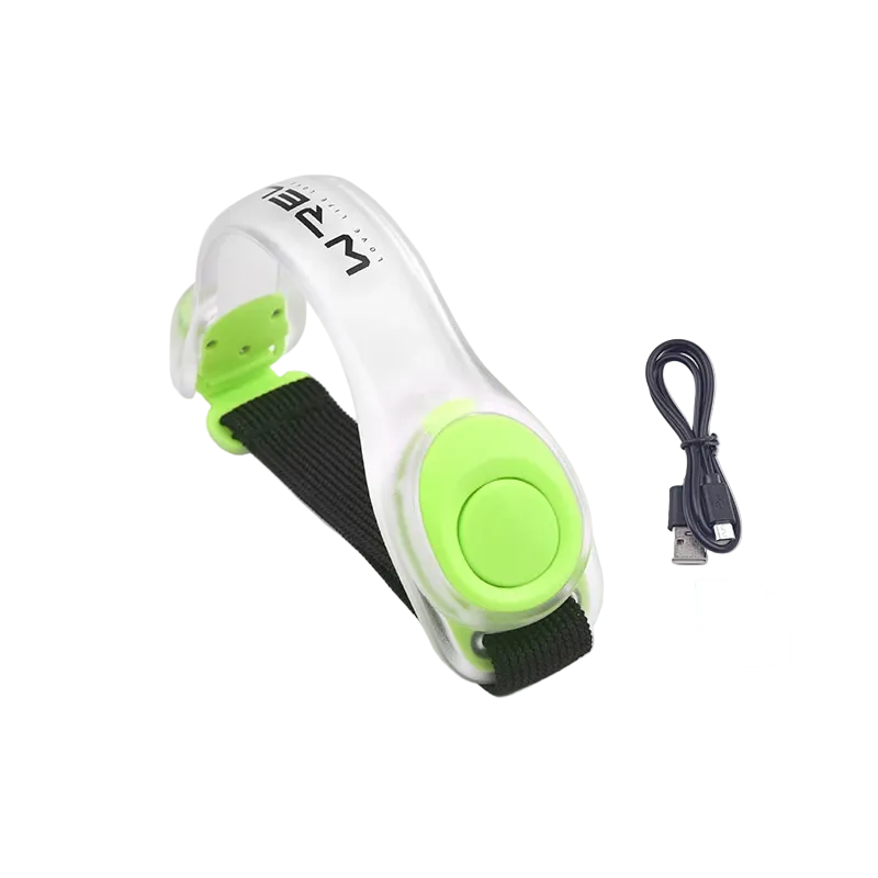 White and green electronic LED runner's safety light arm band with USB cable on a white background