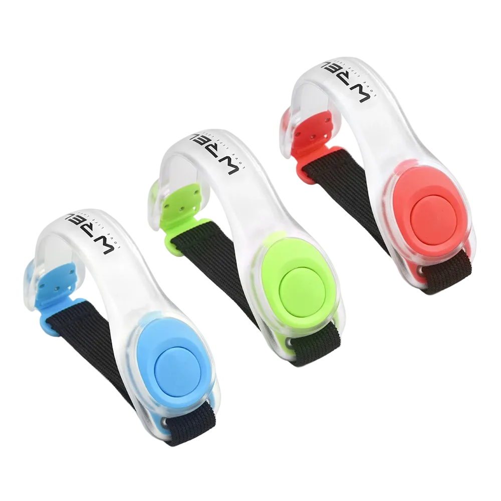Three colorful LED light runner safety wristbands with a black nylon adjustable strap on a white background